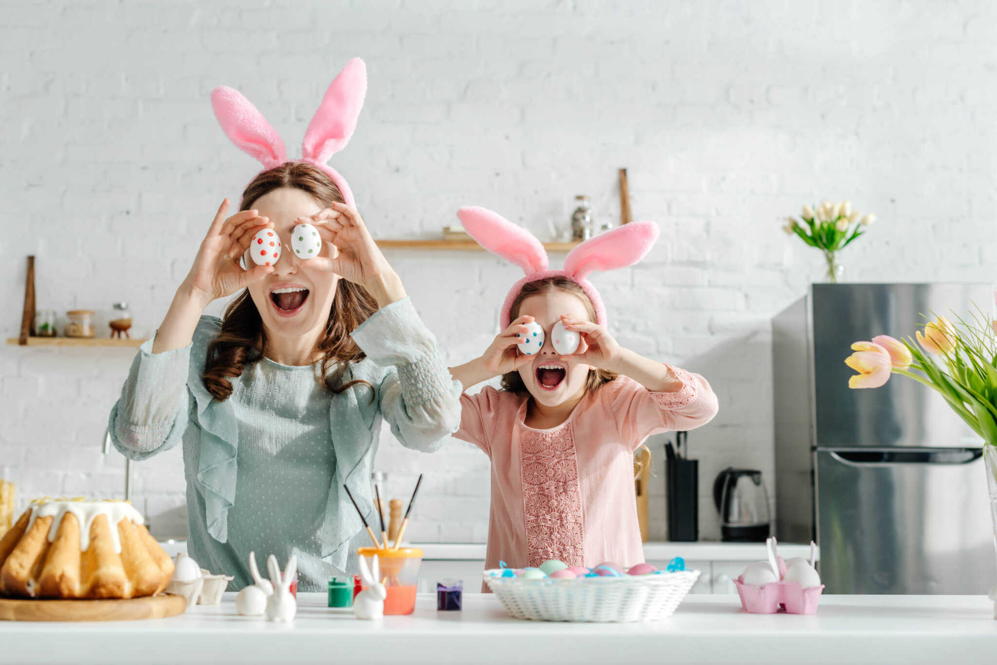 Excited,Mother,And,Daughter,In,Bunny,Ears,Covering,Eyes,With